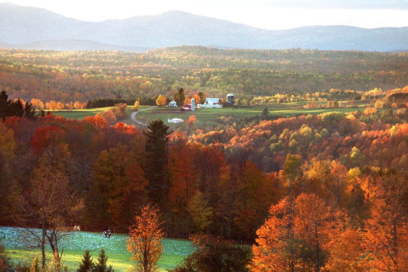 As the sun begins to set, it highlights a farm and some of the fall floiage in Vermont File/UPI/Sandy Macys