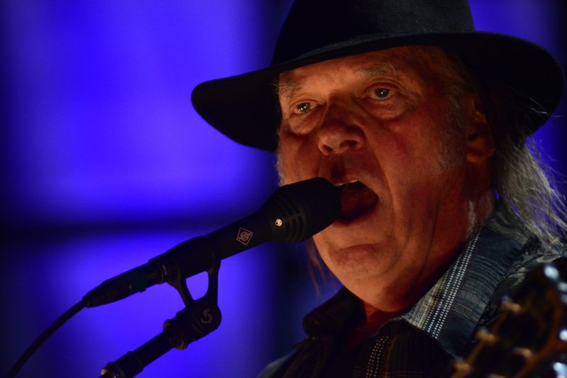 Neil Young performs at Farm Aid 2017 at the KeyBank Pavilion in Burgettstown, Pennsylvania in 2017. Spotify lost billions in market value after Young pulled his music catalog from the streaming giant over his concerns that podcaster Joe Rogan was spreading COVID-19 misinformation. File Photo by Archie Carpenter/UPI