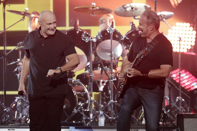 Phil Collins (L) and Daryl Stuermer will reunite with their band Genesis this fall for a North American concert tour. File Photo by John Angelillo/UPI