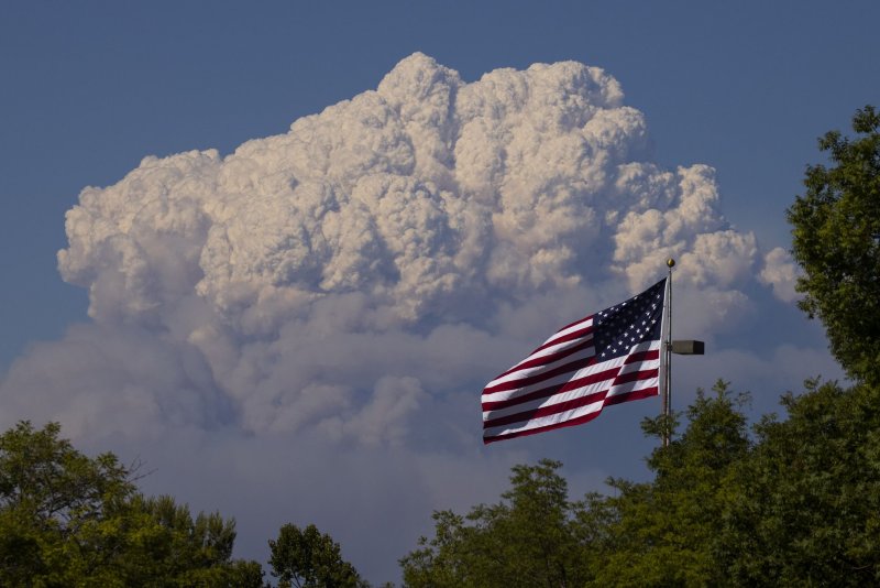 Heavy plumes of smoke billow from the Dixie fire above the Plumas National Forest, seen from Oroville, California, on July 22, 2021. File Photo by Peter DaSilva/UPI
