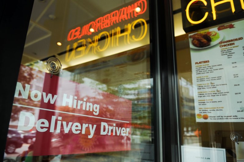 A "Now Hiring" sign is displayed in the window of a restaurant in the Tenlytown neighborhood of Washington D.C. on August 12, 2010. Job openings increased in August, according to the Labor Department on Tuesday. File Photo by Alexis C. Glenn/UPI