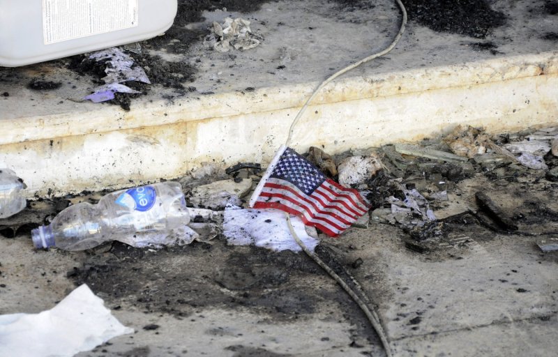 A small American flag is seen in the rubble at the United States consulate, one day after armed men stormed the compound and killed the U.S. Ambassador Christopher Stevens and three others in Benghazi, Libya on September 12, 2012. The gunman were protesting a little known film by an American amateur filmmaker that angered Muslims as it was deemed insulting to the Prophet Mohammad. UPI/Tariq AL-hun