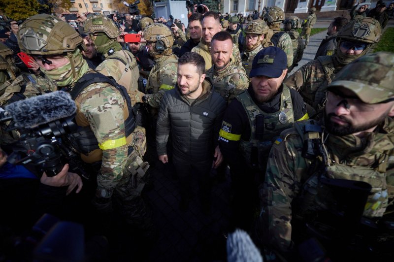 Ukrainian President Volodymyr Zelensky participates in a flag-raising ceremony in the center of Kherson, a port city in Ukraine recently liberated from Russian occupying forces, on November 14, 2022. File Photo via Ukrainian Presidential Press Office/UPI