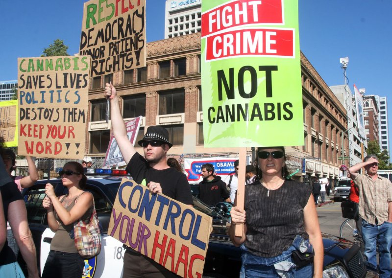 Pro-medical marijuana demonstrators protest outside a fundraiser for President Barack Obama at the Fox Theater in Oakland, Calif., on July 23, 2012. On Tuesday, the city council in nearby Berkeley voted to make the city a sanctuary for marijuana users and sellers. File Photo by David Yee/UPI