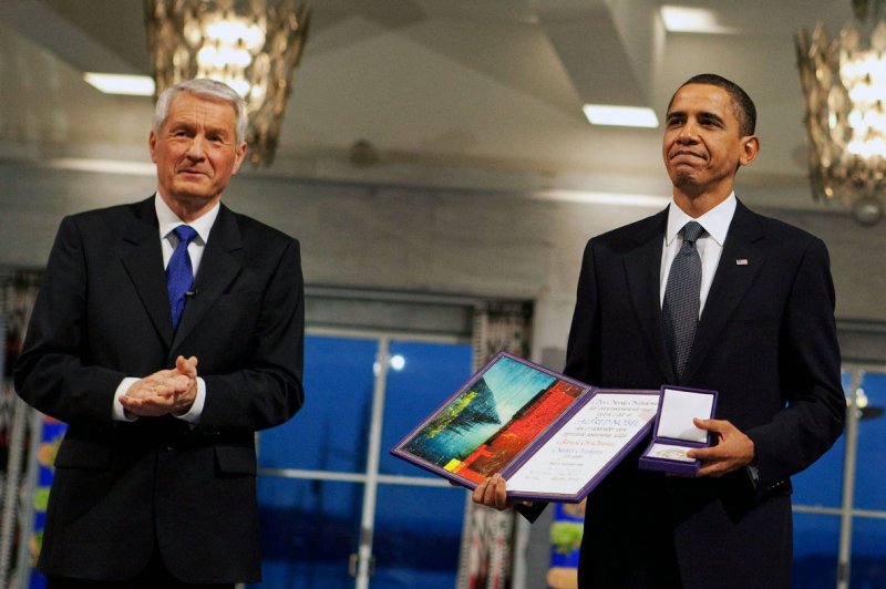 Nobel Committee Chairman Thorbjorn Jagland (L) presents U.S. President Barack Obama with the Nobel Prize medal and diploma during the Nobel Peace Prize ceremony in Raadhuset Main Hall at Oslo City Hall in Oslo, Norway on December 10, 2009. UPI/Pete Souza/The White House