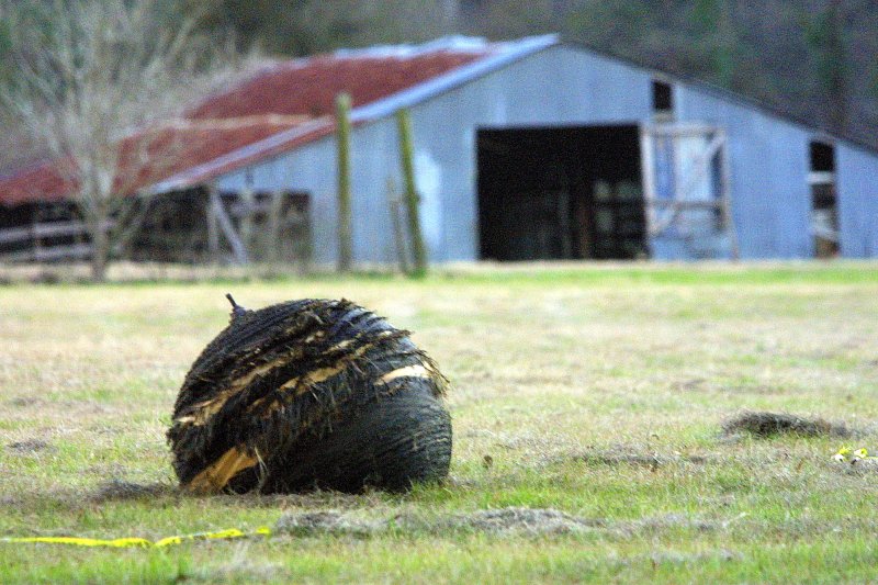 A piece of the space shuttle Columbia dropped in a pasture just outside of San Augustine, Texas, on February 1, 2003. File Photo by Joe Mitchell/UPI