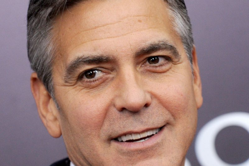 George Clooney arrives on the red carpet at 'The Monuments Men' premiere at the Ziegfeld Theatre in New York City on February 4, 2014. UPI/Dennis Van Tine