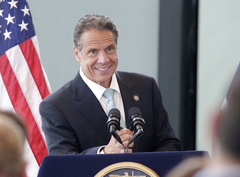 Former New York Gov. Andrew Cuomo smiles when he arrived for his speech to make an official announcement that New York State has lifted all COVID restrictions and lockdowns on June 15, 2021. Photo by John Angelillo/UPI