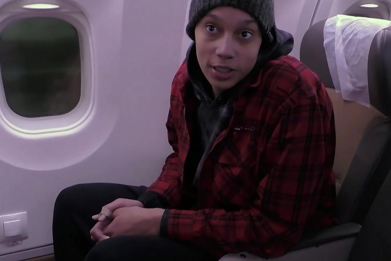 US basketball player Brittney Griner is seen on a plane ahead of departing for the United States on Friday. (A still image grabbed from a video provided by Russian Federal Security Service / UPI)