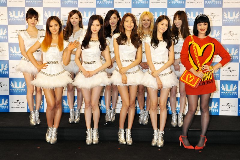 Girls' Generation, pictured with Katy Perry (R), returned with the album "Forever 1" and a music video for their song of the same name. File Photo by Keizo Mori/UPI