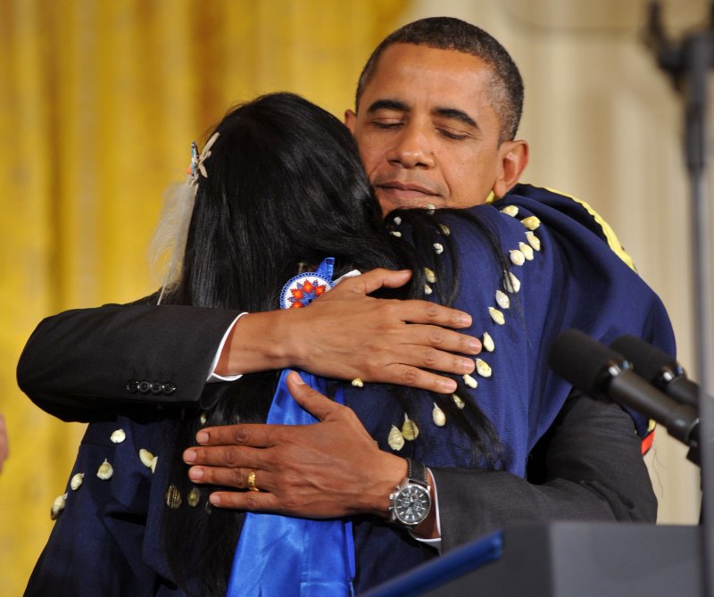 President Barack Obama embraces Lisa Marie Lyotte, a member of the Sicangu Lakota Ospaya tribe who was raped and beaten, prior to Obama signing the Tribal Law and Order Act in the East Room at the White House in Washington on July 29, 2010. UPI/Kevin Dietsch