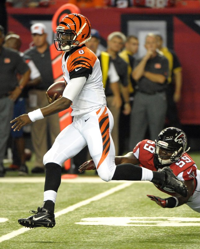 Former Cincinnati Bengals quarterback Josh Johnson, just hired by the Bills, runs the keeper past Atlanta Falcons' Joplo Bartu (59) for a first down in the first half of a preseason game at the Georgia Dome in Atlanta on August 8, 2013. UPI/David Tulis
