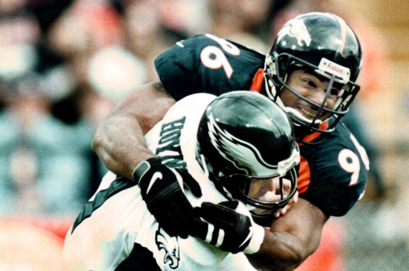 Denver Broncos pass rusher Harald Hasselbach sacks Philadelphia quarterback Bobby Hoying in a 41-16 win over the Eagles on Oct. 4, 1998 in Denver. File Photo by Alex Jennings/UPI