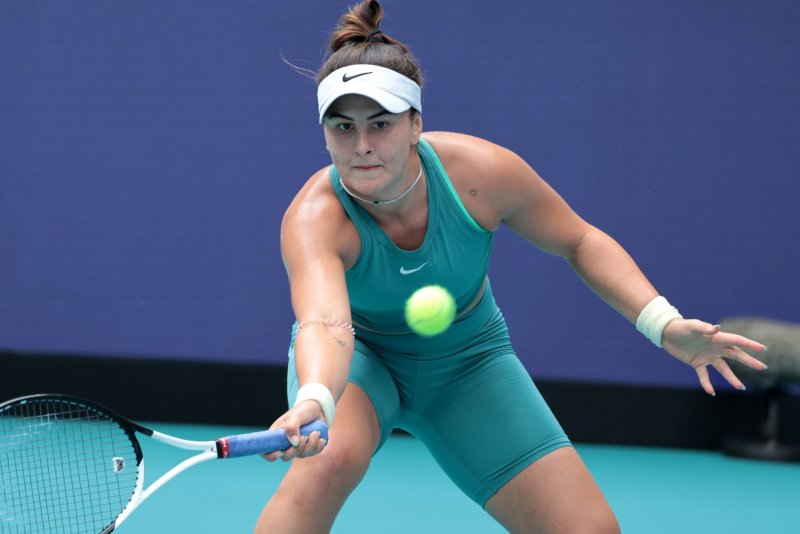 Bianca Andreescu of Canada hits a low forehand shot to Maria Sakkara of Greece during Day 3 of the Miami Open in Hard Rock Stadium in Miami Gardens, Fla, on Friday. Andreescu upset Sakkara 7-7, 6-3, 6-4. Photo by Gary I Rothstein/UPI