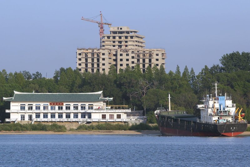 New buildings being built in the North Korean city Sinuiju, across the Yalu River from Dandong, China. North Korean merchants who cross the border for business purposes are the target of state-sponsored bribery, according to a source in the country. File Photo by Stephen Shaver/UPI