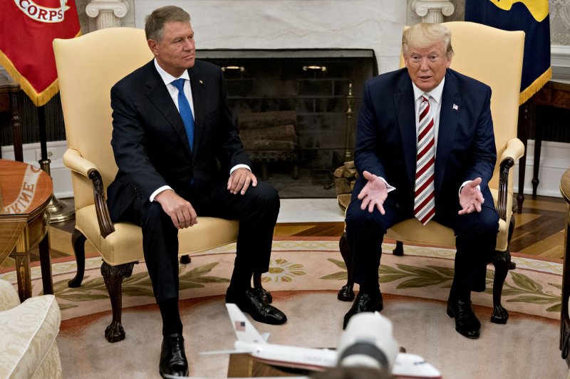 U.S. President Donald Trump met with Romanian President Klaus Iohannis at the White House Tuesday. He also confirmed that he would consider a payroll tax cut.&nbsp; Photo by Andrew Harrer/UPI