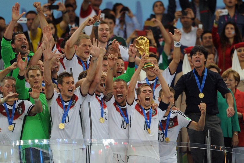 Philipp Lahm of Germany lifts the trophy following the 2014 FIFA World Cup Final at the Estadio do Maracana in Rio de Janeiro, Brazil on July 13, 2014. Photo by Chris Brunskill/UPI