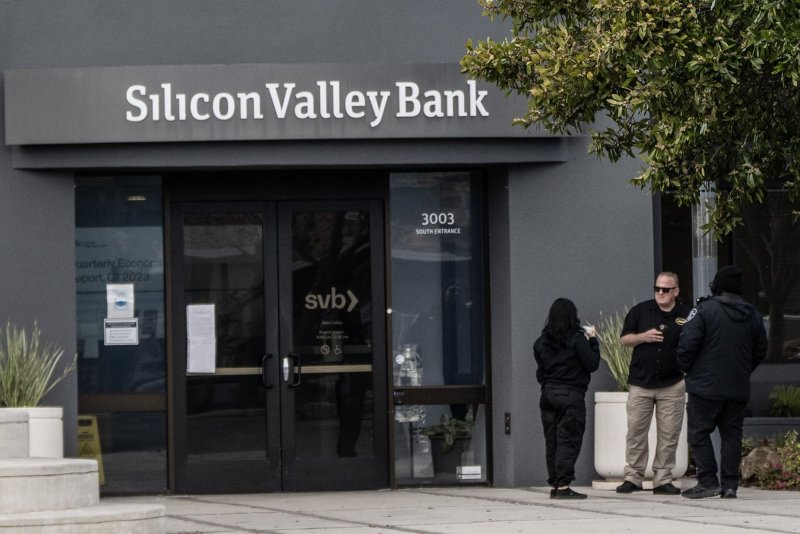 Security guards stand outside the headquarters of the Silicon Valley Bank in Santa Clara, Calif., on March 11. The Federal Deposit Insurance Corp. said Monday it will allow the bank to be separated and sold. Photo by Terry Schmitt/UPI