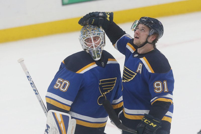 St. Louis Blues Vladimir Tarasenko of Russia congratulates goaltender Jordan Binnington after a 3-2 overtime win against the Toronto Maple Leafs at the Enterprise Center in St. Louis on February 19, 2019. The NHL said it has suspended a working arrangement with Russia's KHL on Monday. File Photo by Bill Greenblatt/UPI | <a href="/News_Photos/lp/094593672725ee05bceaa717b0bc1a92/" target="_blank">License Photo</a>