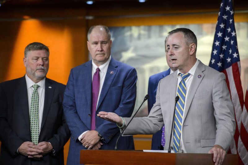 Rep. Brian Fitzpatrick, R-Pa., (at right in 2022) released a proposal on behalf of the Problems Solvers Caucus on Wednesday that would raise the debt limit. File Photo by Bonnie Cash/UPI