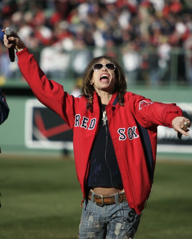 Aerosmith lead singer Steven Tyler sings 'God Bless America' during the seventh inning stretch of the Red Sox home opener against the Detroit Tigers at Fenway Park in Boston, Massachusetts on April 8, 2008. (UPI Photo/Matthew Healey)