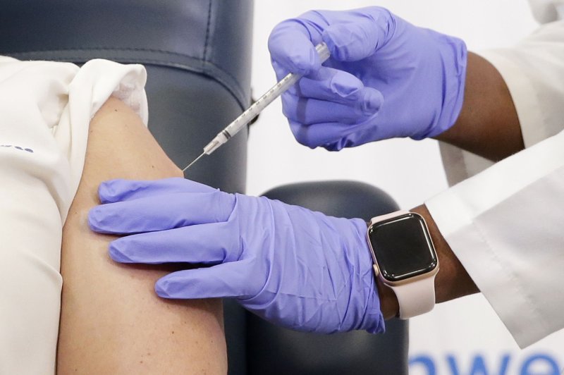 One of the first Pfizer-BioNTech coronavirus vaccines is administered in New York City on Monday. Photo by John Angelillo/UPI