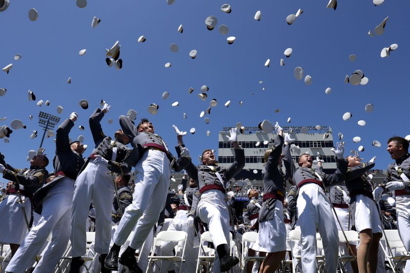 Cadets celebrate the graduation hat toss at the conclusion of the West Point graduation ceremony in Michie Stadium at the United States Military Academy in West Point, New York on May 27. A Defense Department report said the population of service members declined in 2022. File Photo by John Angelillo/UPI