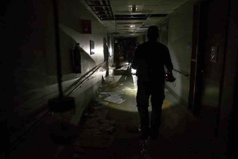 U.S. Marines, left in the dark amid widespread power outages, conduct an assessment as part of Hurricane Maria relief efforts in Humacao, Puerto Rico, on September 27. Photo by Lance Cpl. Tojyea G. Matally/U.S. Marine Corps/UPI | <a href="/News_Photos/lp/bb1ad60c78f793f4ed62b9177b4a05a4/" target="_blank">License Photo</a>