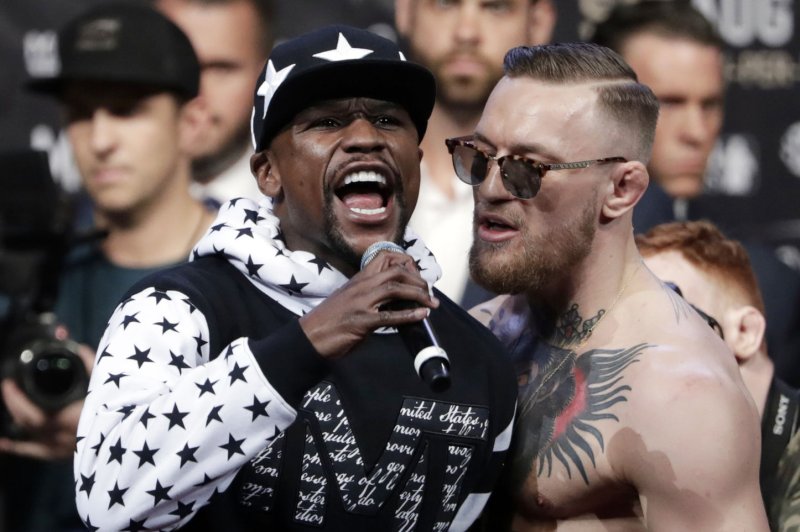 Fighter Floyd Mayweather Jr. (L) and fighter Conor McGregor exchange words at a press tour news conference at Barclays Center on Thursday in New York City. The two will fight in a boxing match in Las Vegas on August 26th, 2017. Photo by Jason Szenes/UPI | <a href="/News_Photos/lp/48e8025a99c0df4ba822ac066f670893/" target="_blank">License Photo</a>