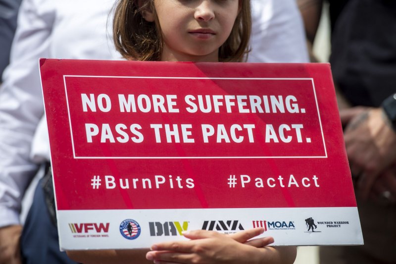 Brielle Robinson, the 9-year-old daughter of Sergeant First Class Heath Robinson, holds a poster Thursday during a press conference in Washington on the Senate's failure to pass The PACT Act, which includes health care, presumption of service-connection, research, resources, and other matters related to veterans who were exposed to toxic substances during military service. Photo by Bonnie Cash/UPI | <a href="/News_Photos/lp/e85041f1e61023fa53bffa1b140a3c9c/" target="_blank">License Photo</a>