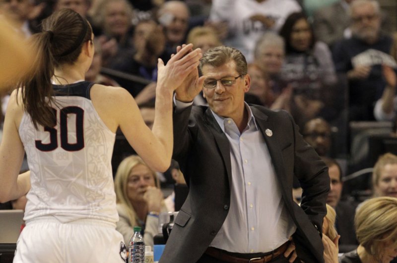 UConn Huskies' head coach Geno Auriemma celebrates with Breanna Stewart (30) during the second half of play against Oregon State in their National Semifinal game of 2016 NCAA Division I Women's Basketball Championship at Bankers Life Fieldhouse in Indianapolis, Indiana, April 3, 2016. .Photo by John Sommers II/UPI