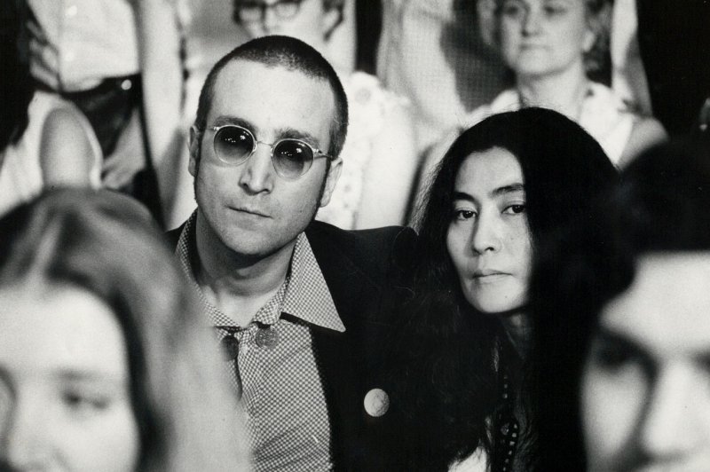 John Lennon and Yoko Ono listen in on the Watergate hearings on Capitol Hill in 1973. On December 8, 1980, Lennon was shot to death outside his apartment building in New York City. He was 40. UPI File Photo