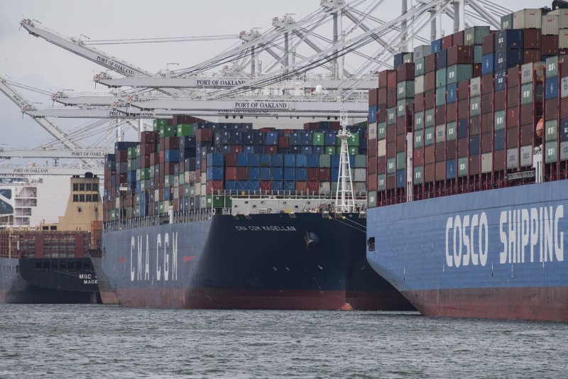 Containers are off-loaded from ships in the Port of Oakland in Oakland, Calif. on May 14, 2019. The United States said Thursday its trade deficit grew to $80.9 billion. File Photo by Terry Schmitt/UPI