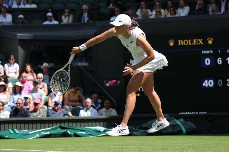 Poland's Iga Swiatek advanced to the third round with a three-set victory at Wimbledon on Thursday in London. Photo by Hugo Philpott/UPI | <a href="/News_Photos/lp/aa886e077a0df43707fb8ca70832af72/" target="_blank">License Photo</a>