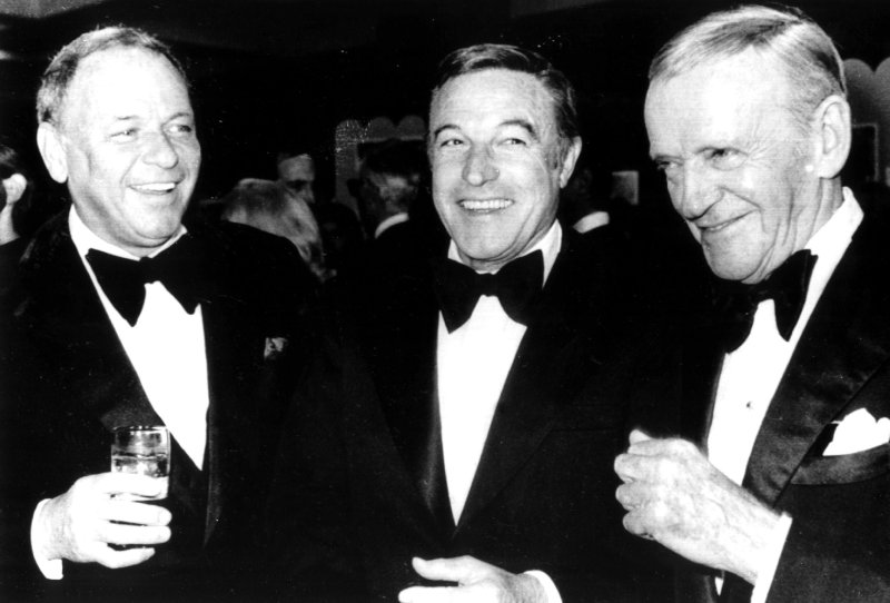 Legendary dancer, actor, director Gene Kelly, seen here in this 1975 file photo, with singer Frank Sinatra (L) and legendary dancer Fred Astaire (R) died on February 2, 1996, at age 83 in his Beverly Hills home. Kelly had suffered two strokes in the past year. (UPI Photo/Files)