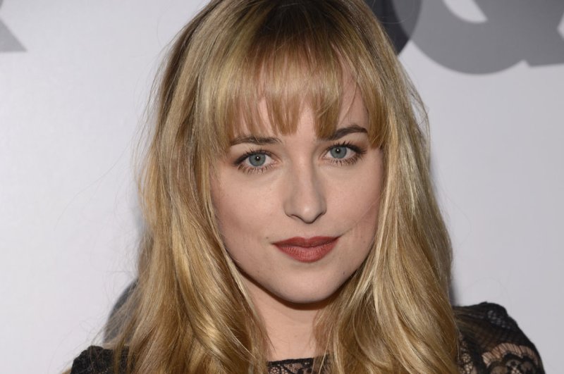 Dakota Johnson attends the 2012 GQ "Men of the Year" party at the Chateau Marmont. Johnson said she is still gearing up for her role in "Fifty Shades of Grey," despite costar Charlie Hunnam leaving. UPI/Phil McCarten | <a href="/News_Photos/lp/7761e3a5be03398558893b34938b683e/" target="_blank">License Photo</a>