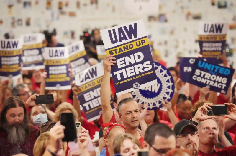 Striking United Auto Workers from the General Motors Wentzville Assembly Plant hold up signs in solidarity during a rally in Wentzville, Mo., on September 24. File Photo by Bill Greenblatt/UPI