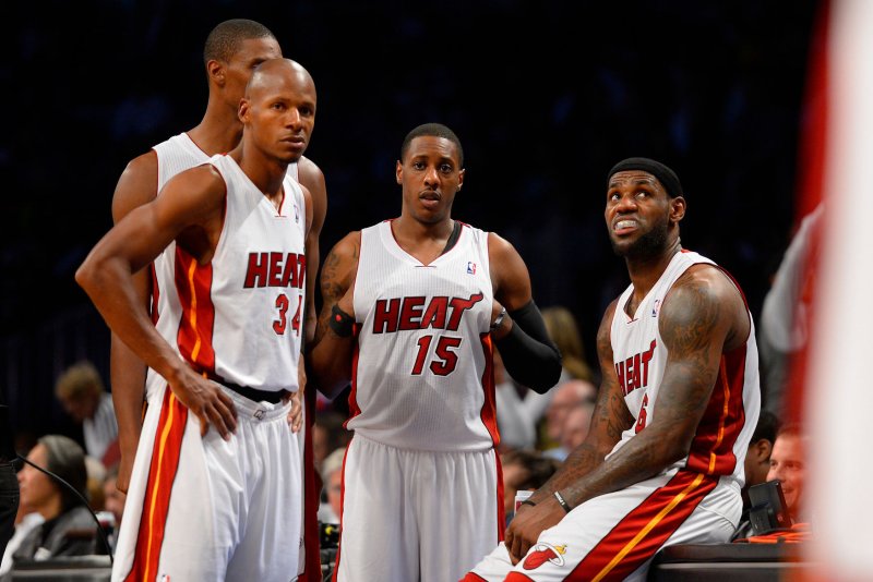 Miami Heat shooting guard Ray Allen (34), Heat point guard Mario Chalmers (15) and Heat small forward LeBron James (6) look on during a timeout in the fourth quarter against the Brooklyn Nets on Nov. 1, 2013 at Barclays Center in New York City on November 1, 2013. File photo by Rich Kane/UPI