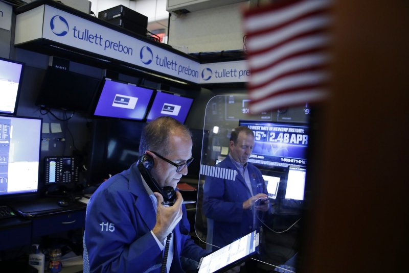 Dow bounces back 311 points, erasing Monday losses, amid tech rebound