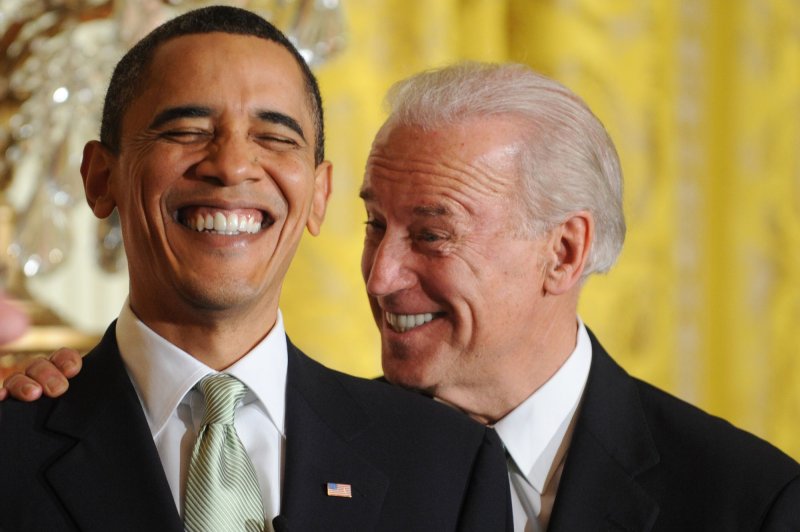 U.S. President Barack Obama (L) and Vice President Joe Biden laugh during the annual St. Patrick's Day Reception in the East Room of the White House in Washington on March 17, 2010. UPI/Michael Reynolds/Pool | <a href="/News_Photos/lp/4c5f27db079ca1377c8fe203f10a2532/" target="_blank">License Photo</a>