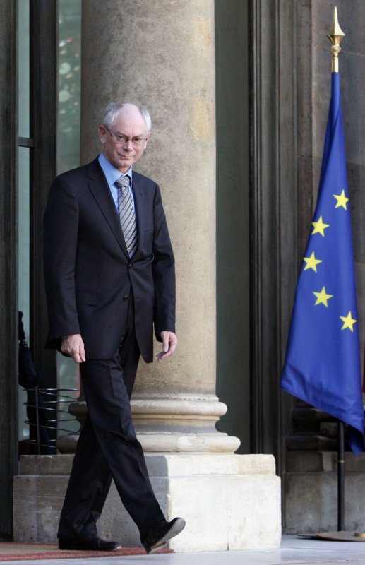 EU's first president Herman Van Rompuy walks past a EU flag as he leaves the Elysee Palace, in Paris, December 04, 2008, after meeting with French President Nicolas Sarkozy. Van Rompuy embarked on a tour of European capitals after he was chosen for the newly-created post at an EU summit last month. UPI/Eco Clement