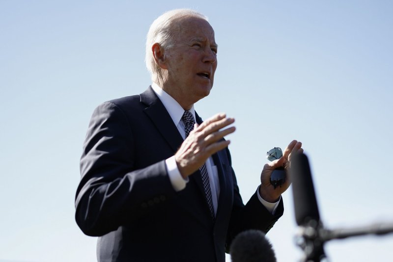 President Joe Biden speaks to reporters Monday after arriving at Fort Lesley J. McNair in Washington, D.C. In his remarks, Biden condemned Russian leader Vladimir Putin as a "war criminal" for his war in Ukraine and said he should face trial. Photo by Ting Shen/UPI