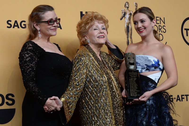 Billie Lourd (R), pictured with Carrie Fisher (L) and Debbie Reynolds, honored Reynolds with an Instagram post Sunday. File Photo by Jim Ruymen/UPI