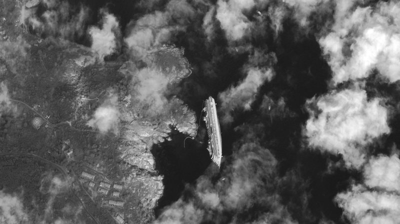 A satellite image captured by Digital Globe of the Costa Concordia, a luxury cruise ship that ran aground in the Tuscan waters off of Giglio, Italy UPI/Digital Globe/HO