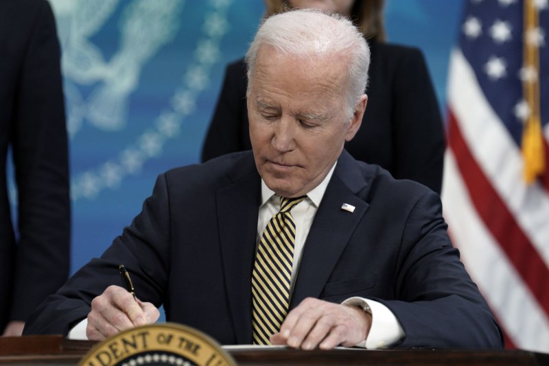U.S. President Joe Biden signs an economic and military assistance to Ukraine in the South Court Auditorium at the White House in Washington on March 16. Photo by Yuri Gripas/UPI