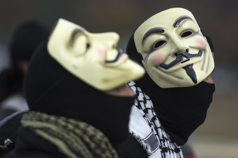 Members and supporters of the Anonymous hacking group wear Guy Fawkes masks. File Photo by Kevin Dietsch/UPI