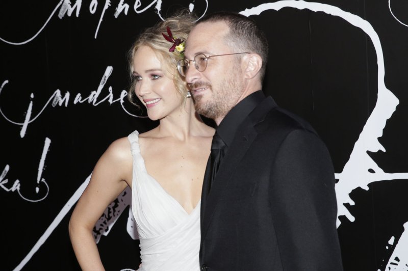 Jennifer Lawrence (L), pictured with Darren Aronofsky, discussed her lingering feelings for the director in a new interview. File Photo by John Angelillo/UPI