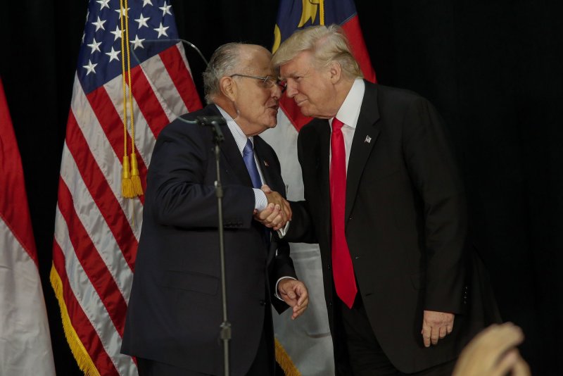 Former New York City Mayor Rudy&nbsp;Giuliani&nbsp;greets Republican Presidential candidate Donald Trump at a Trump rally in Charlotte, N.C., on August 18, 2016. File Photo by Nell Redmond/UPI