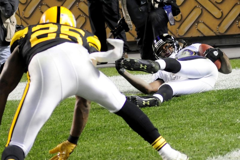 Pittsburgh Steelers Ryan Clark watches as Baltimore Ravens Torrey Smith slides out of the end zone after pulling in a 26 yard pass for a touchdown giving the Ravens a 23-20 win in the final seconds of the fourth quarter against the Steelers at Heinz Field in Pittsburgh, Pennsylvania on November 6, 2011. UPI/Archie Carpenter