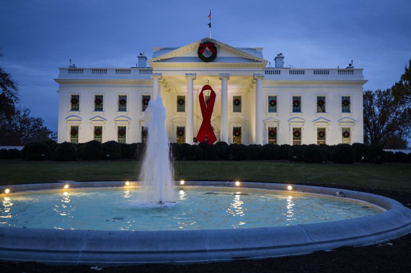 In 2021, the White House displayed a giant red ribbon on the North Portico to recognize World AIDS Day. The White House on Friday reaffirmed its commitment to combating HIV/AIDS and cited past and ongoing progress on the 35th annual observance of World AIDS Day. File Photo by Jim Lo Scalzo/UPI